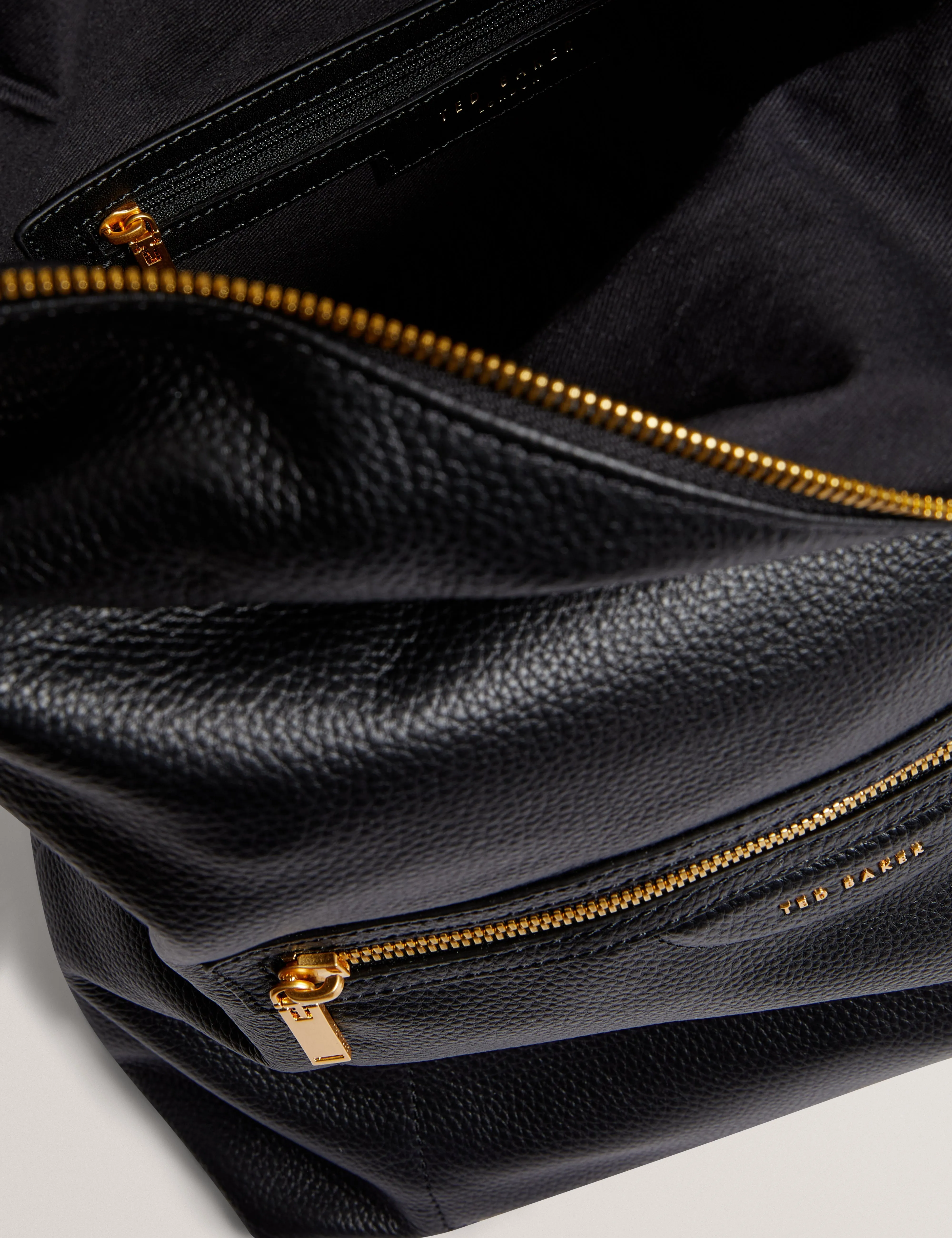 Essaya Pebbled Leather Fold Over Backpack Black